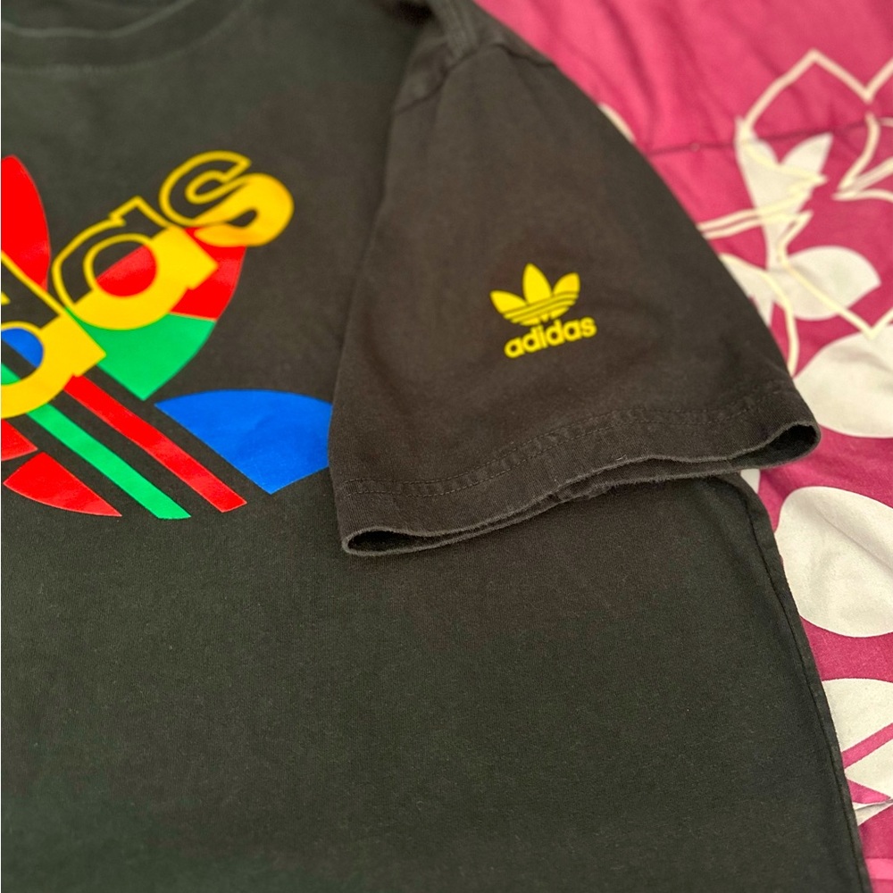 Black with multicolored Adidas symbol.